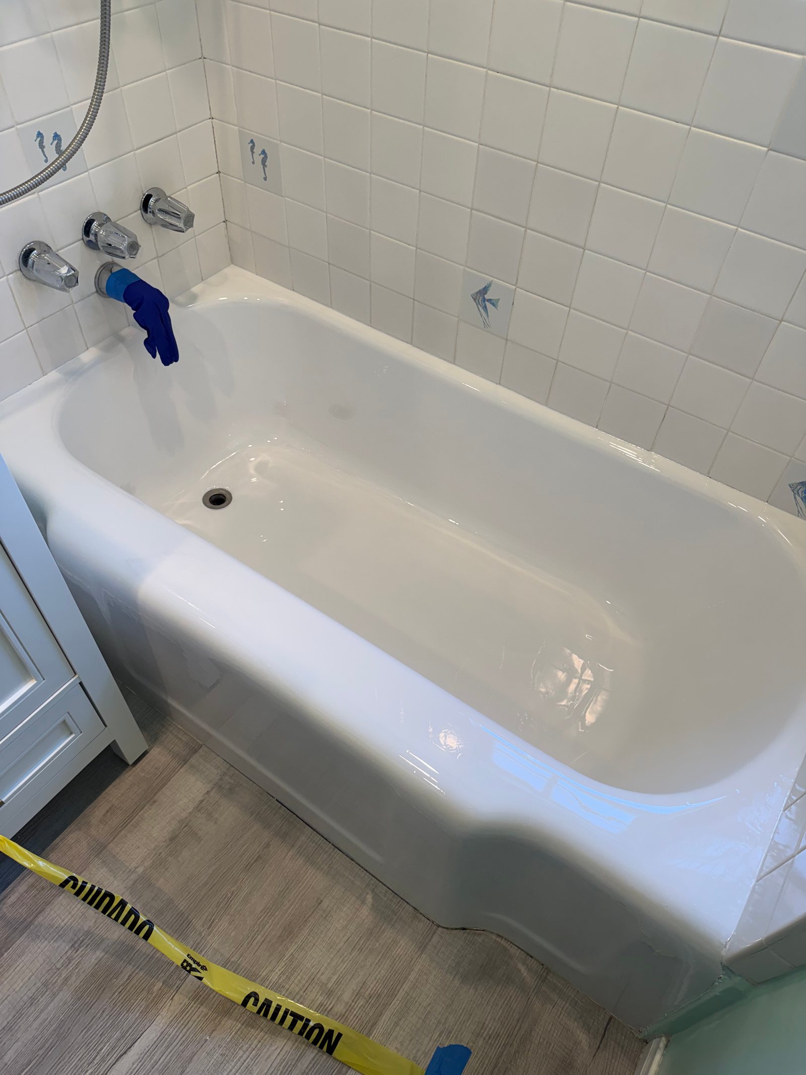 Completely refinished glossy white cast iron bathtub