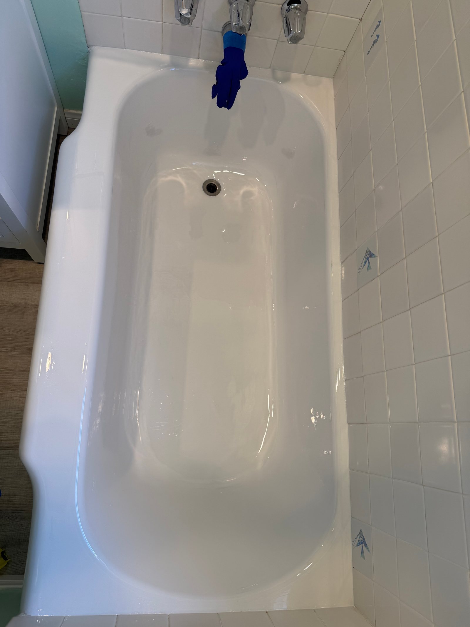 Refinished glossy bathtub viewed from above