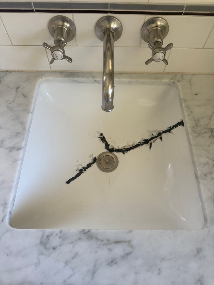 Sink crack filled with structural compound