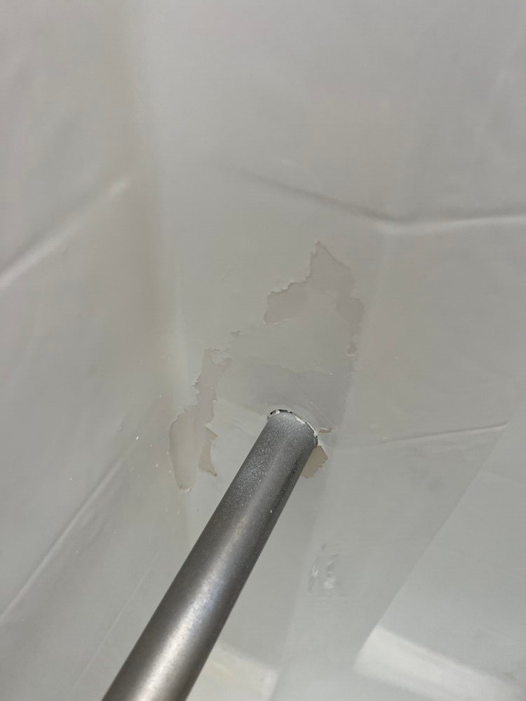 Peeling paint near shower rod